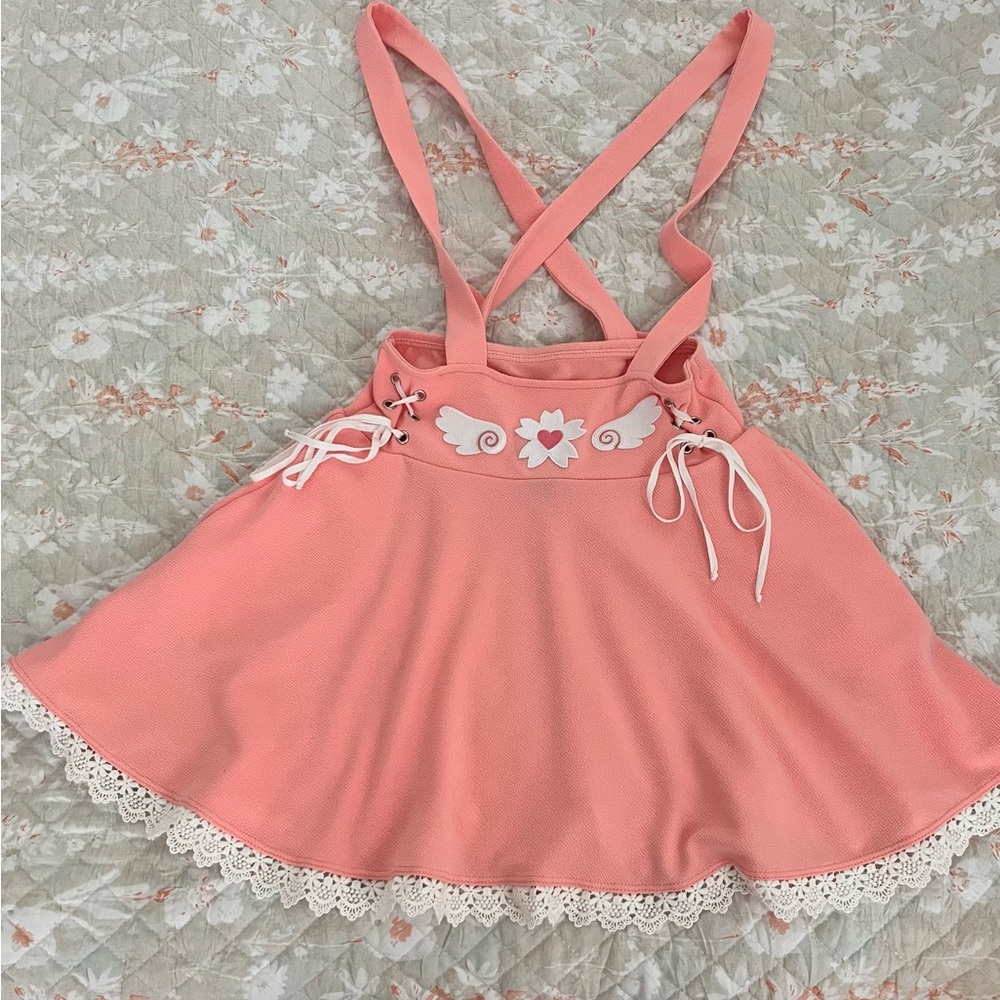 Pink lace trimmed romper.